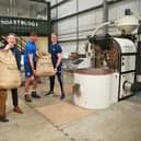 Cafeology's sustainability manager Liam Worsley, left, unloads the coffee he helped pick in Costa Rica with members of Sheffield RUFC, one of Cafeology's local customers