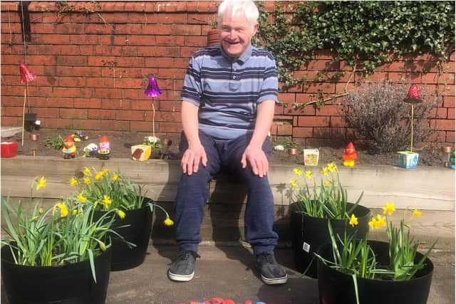David Jepson of Harry Priestley House with the donated flowers.