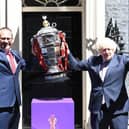 Bitter blow: Rugby League World Cup chief executive Jon Dutton with Prime Minister Boris Johnson and the men's trophy. Now the tournament is in doubt. Picture by Simon Wilkinson/SWpix.com