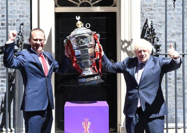 Bitter blow: Rugby League World Cup chief executive Jon Dutton with Prime Minister Boris Johnson and the men's trophy. Now the tournament is in doubt. Picture by Simon Wilkinson/SWpix.com