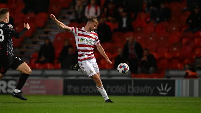 George Millers takes a shot at goal.