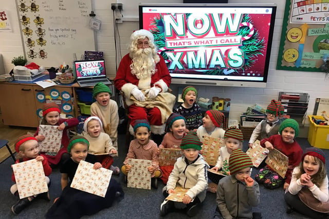 Santa came in to school to visit the KS1 and ER children at Whaley Bridge Primary. Pictured the Bumblebee Class (Reception) who sang 'When Santa Got Stuck Up The Chimney'
