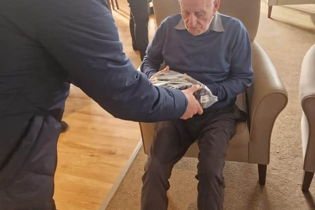 Handing out gifts in the care home.