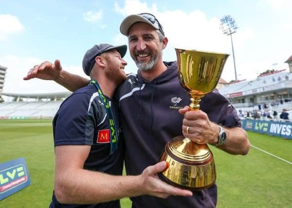 GREAT DAYS: Yorkshire captain Andrew Gale and head coach Jason Gillespie celebrate with the County Championship trophy back in September 2014 - the first of two in as many years. Picture by Alex Whitehead/SWpix.com
