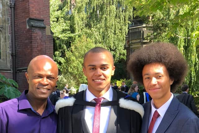 Joel (right) next to his brother Patrice (centre) and dad Femi (left).