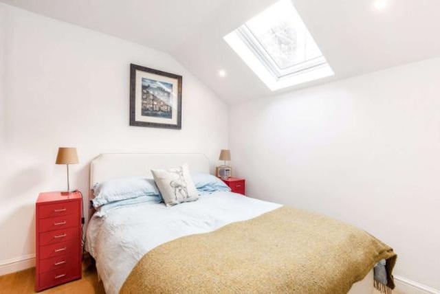 This modern bedroom is spacious and lets in a lot of light