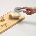 A garlic press in action