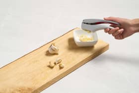 A garlic press in action