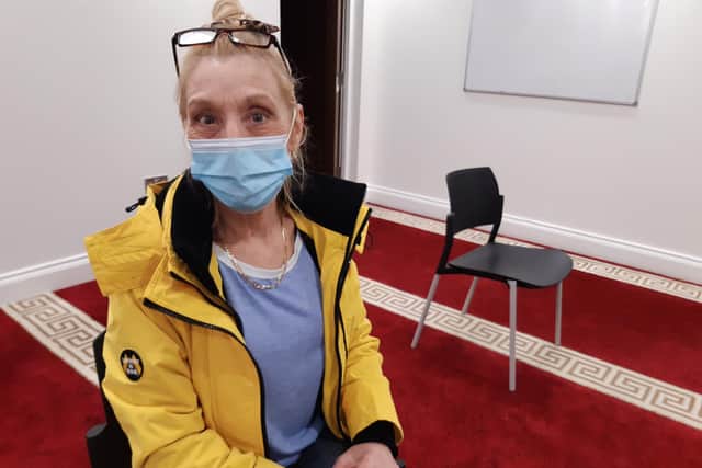 Kay Saunders waits to go home home after her vaccine at Belle Vue Mosque, Doncaster