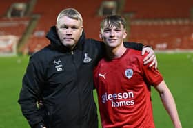 Grant McCann and his son Bayley McCann, who made his full debut for Barnsley in the EFL Trophy tie against Rovers.