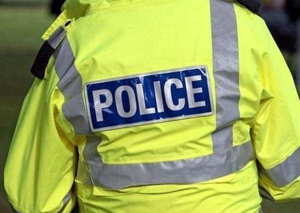 Police recovered the large wad of cash and suspected drugs after executing two warrants under the Misuse of Drugs Act.