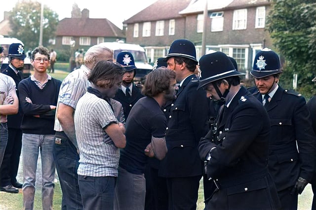 Police and striking miners exchange words in Doncaster.