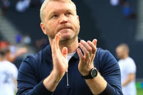 Doncaster Rovers manager Grant McCann applauds the travelling fans at MK Dons.