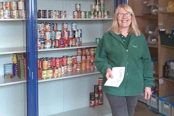 Volunteer Anna who helps at Doncaster Foodbank, which now spends up to £2k a month to fill shelves.