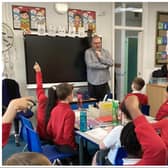 Free Press reporter Darren Burke takes questions from youngsters at Willow Primary School.
