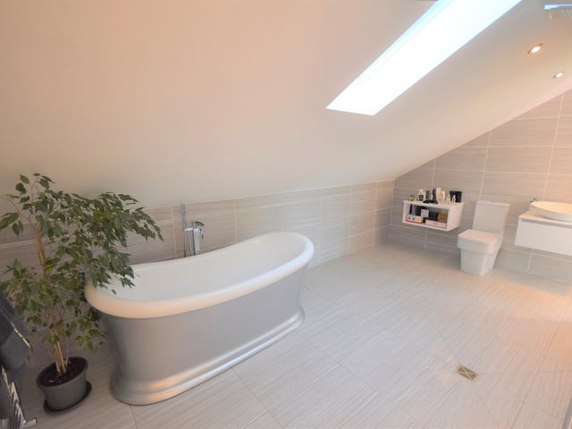This is just one of the bathrooms that the property boasts, with a free standing bath tub.