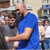 Tyson Fury poses for a selfie with a fan in Thorne.