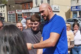 Tyson Fury poses for a selfie with a fan in Thorne.