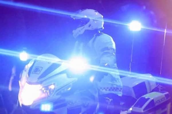 Emergency services were called to the M18 after a woman fell from a motorway bridge.