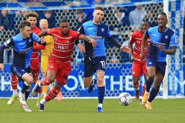 Rovers striker Reo Griffiths battles past Wycombe Wanderers' Lewis Wing and Josh Scowen. Picture: Gareth Williams/AHPIX LTD