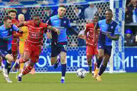 Rovers striker Reo Griffiths battles past Wycombe Wanderers' Lewis Wing and Josh Scowen. Picture: Gareth Williams/AHPIX LTD