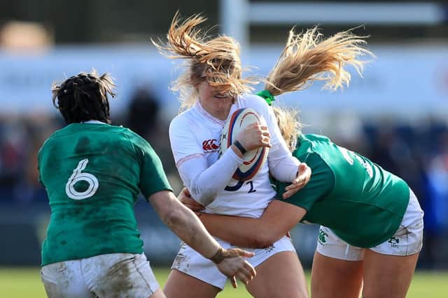 Zoe Harrison of England  is tackled by Ciara Griffin and Dorothy Wall of Ireland. Photo by Matthew Lewis/Getty Images