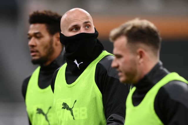 Newcastle United's English midfielder Jonjo Shelvey (C) looks on during the warm up ahead of the English Premier League football match between Newcastle United and Aston Villa at St James' Park in Newcastle-upon-Tyne, north east England on March 12, 2021.