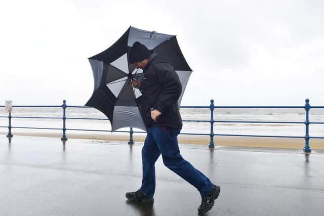 Fighting the high wind coming off the sea at Seaton Carew .Picture by FRANK REID