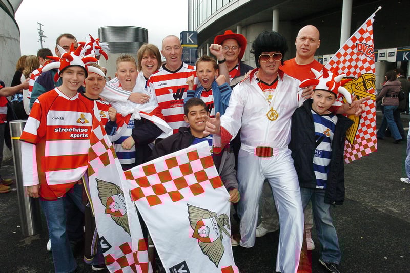 Rovers fans celebrate after winning promotion to the Championship at Wembley
