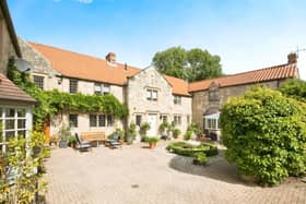 The stone-built property with its appealing courtyard is in central Tickhill.