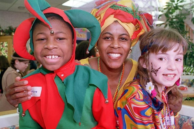 Easter fancy dress competitors at McDonalds on Saint Sepulchre Gate, Doncaster. Dining hostess Cynthia Deans, centre, joins in the fun with 10 year old Jermaine Green and 9 year old Kaylee Daniels, April 1998.