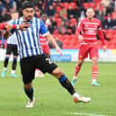 Reo Griffiths fends off Wednesday's Massimo Luongo. Picture: Andrew Roe/AHPIX LTD