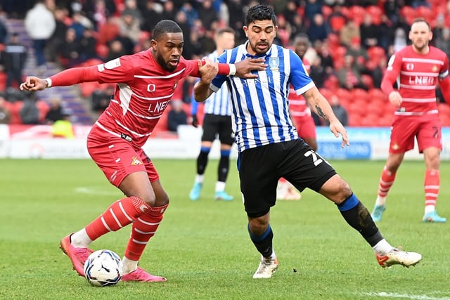 Reo Griffiths fends off Wednesday's Massimo Luongo. Picture: Andrew Roe/AHPIX LTD