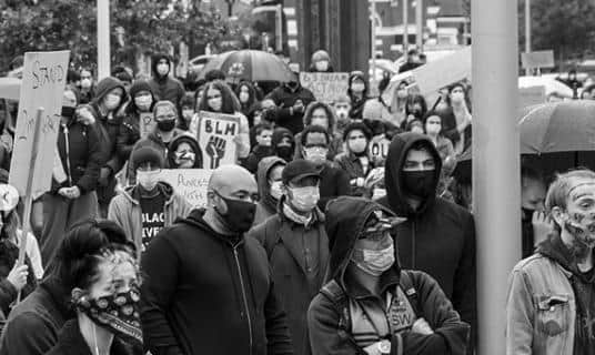 The socially distanced crowd of protesters.