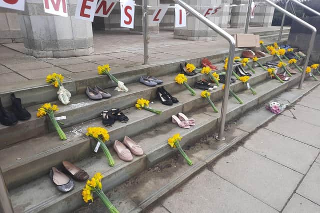 Flowers and shoes were left by Women's Lives Matter protesters.