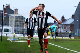 Ross Hannah celebrates scoring for Grimsby Town in the FA Cup in 2014. Photo: Matthew Lewis/Getty Images