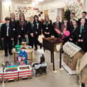 Miss Gerard (second from left) is pictured with Sir Thomas Wharton Academy students delivering their festive hampers to St John’s Hospice.