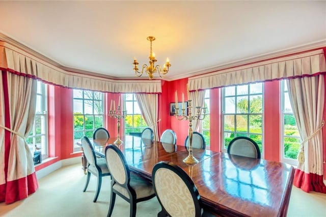 The formal dining room with another feature bay window.