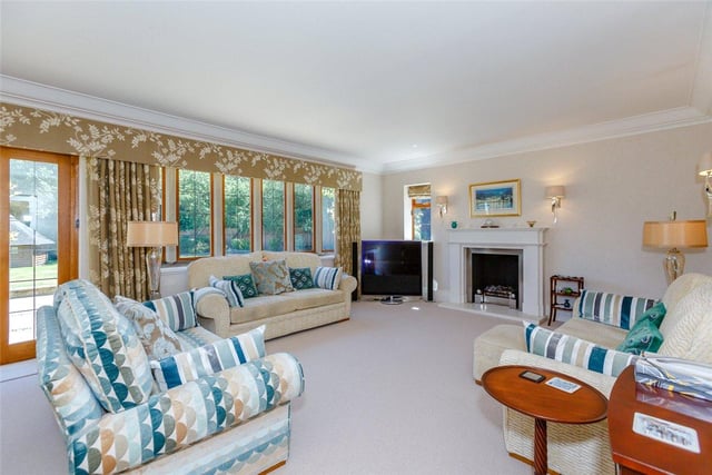Wigton Manor boasts four reception rooms in total, including this formal lounge with a marble fireplace and coal effect gas fire at its heart, and French doors which open out to the garden.