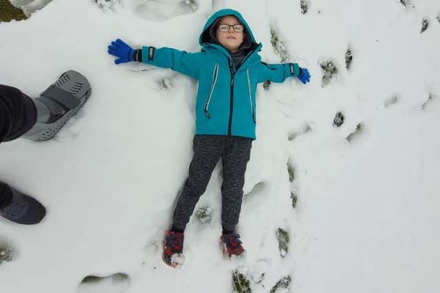 Pupil Ethan pictured making a snow angel