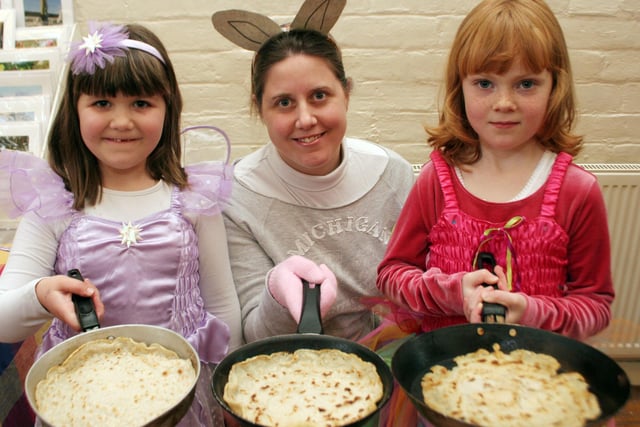 Five-year-old Grace Rowley, left, and six-year-old Emily Lacey with parent Rachel Lacey at a pancake race in Stanton-by-dale, near Ilkeston, in 2007.