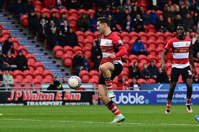 Luke Molyneux has a shot at goal against Accrington Stanley.