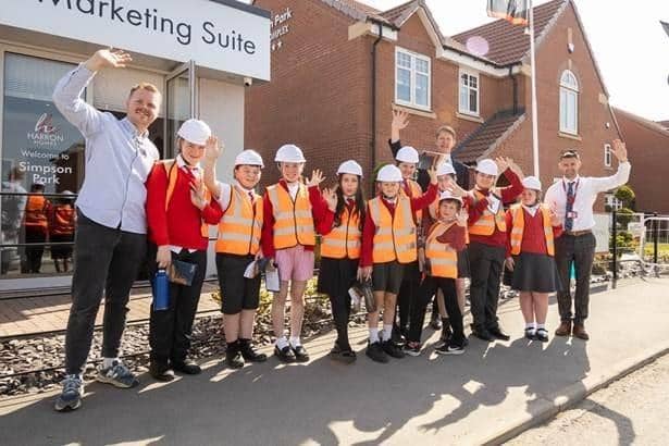 Joshua Johnson (Harworth), with the pupils from Harworth C of E Academy, Paul Walters (Harron Homes) and Joel Edwards (Head of Year 6, Harworth C of E).