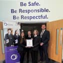 Outwood Academy Danum students and the school's mental health lead, Mr Kelly, with award