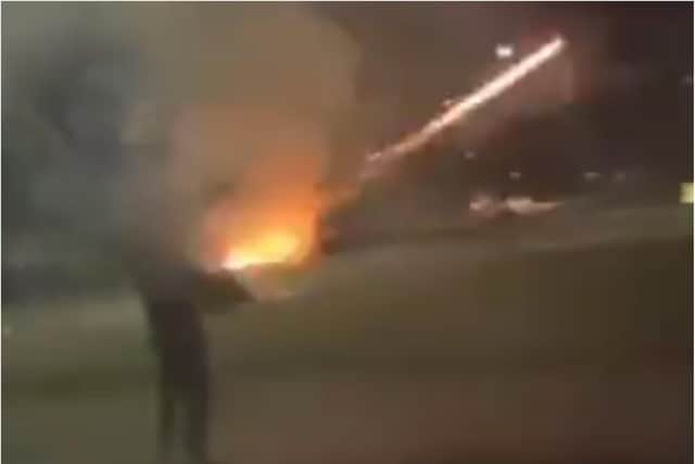 Footage shows a yob deliberately blasting a block of flats with high powered fireworks.