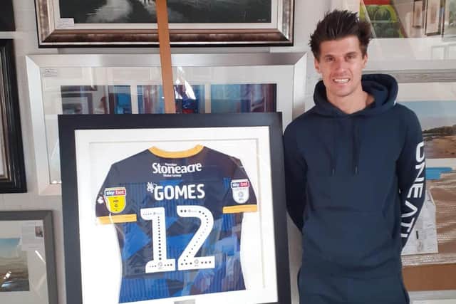 Madger Gomes gave one of his Rovers shirts to personal trainer Ross White as a thank you gift.