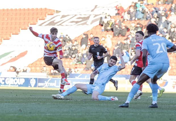 Doncaster Rovers v Harrogate Town League 2 match at the Eco-Power Stadium
Rovers Charlie Crew has his shot blocked by Town's Anthony O'Connor.
Photograph by Tony Johnson. 25th January 2025.