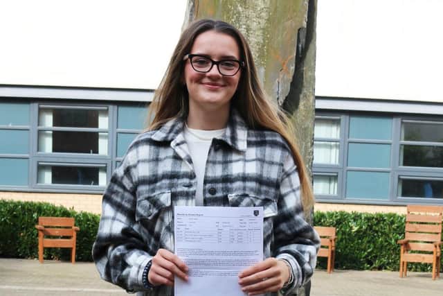 Amy Butler picking up her results from Trinity Academy.