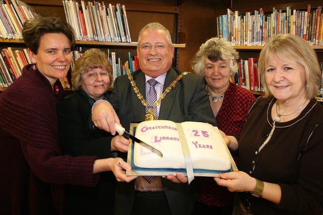 Chairman of Derbyshire County Council Councillor Robin Baldry, centre, helped cut the cake to mark Chesterfield Library’s 25th birthday. From left to right, Derbyshire’s former poet laureate River Wolton, library staff Susan Bradley and Diane Bramley – who worked the day the library first opened - and the county council’s current poet laureate Ann Atkinson in 2010