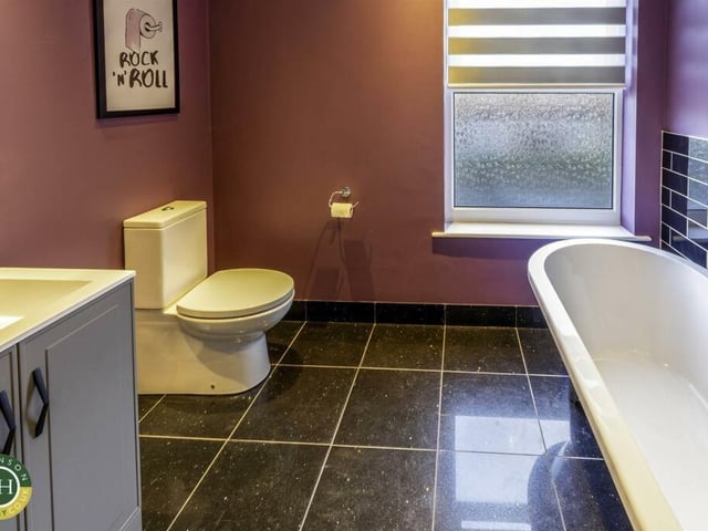 A bathroom with free-standing bath and washbasin vanity unit.